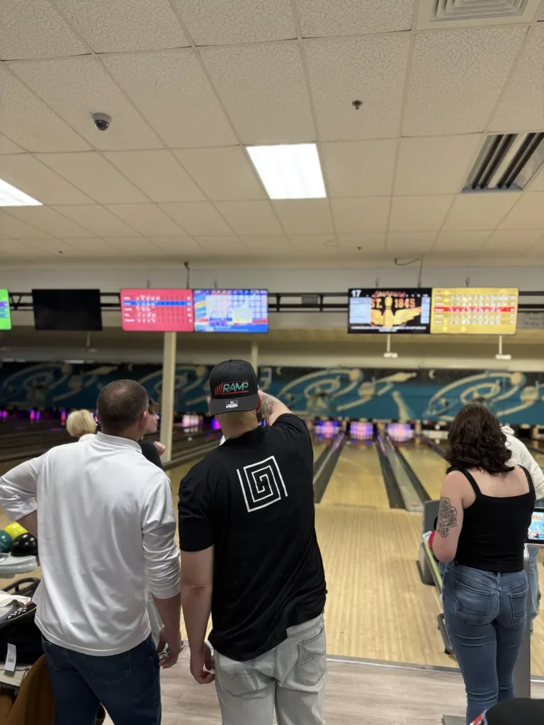 Guests watching from behind the lanes at the Nashoba Springs bowling outing