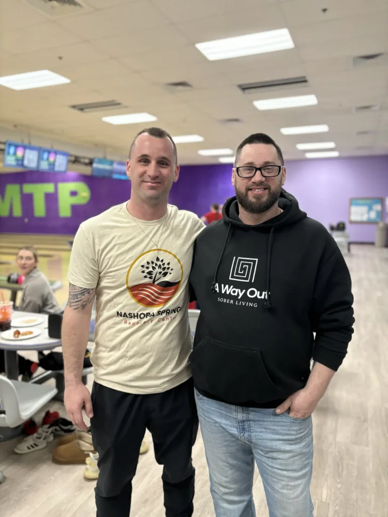 Two Nashoba Springs team members posing at the bowling outing