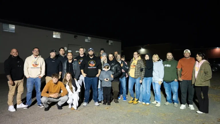 Nashoba Springs group photo outside Fright Kingdom at night