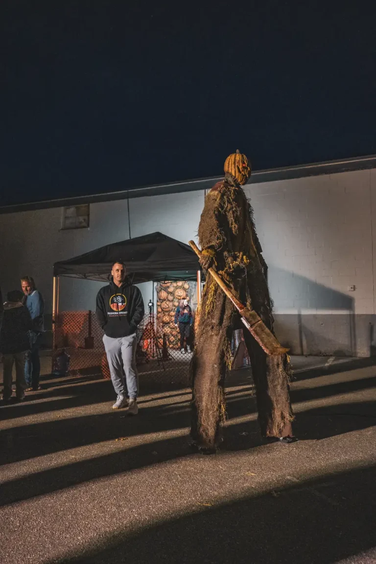 Costumed performer on stilts outside Fright Kingdom during the Nashoba Springs outing