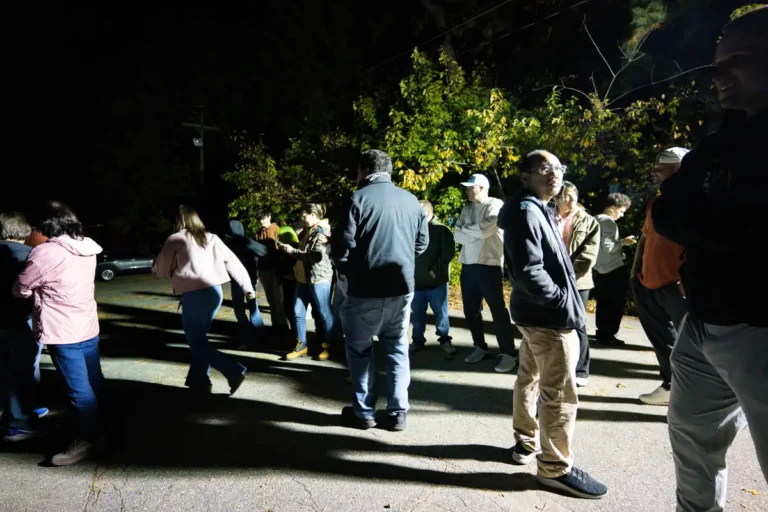 Group walking through the Fright Kingdom grounds at night