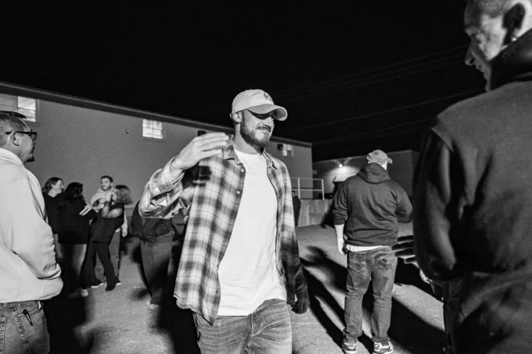 Smiling guest in a plaid shirt during the Nashoba Springs Fright Kingdom outing