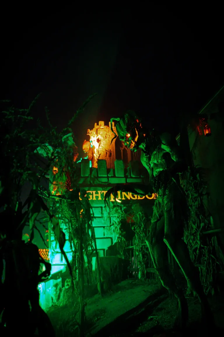 Glowing green entrance to a Fright Kingdom haunted attraction