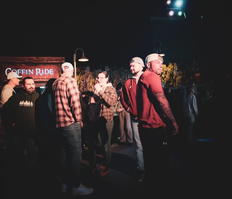 Guests talking near the Coffin Ride at Fright Kingdom