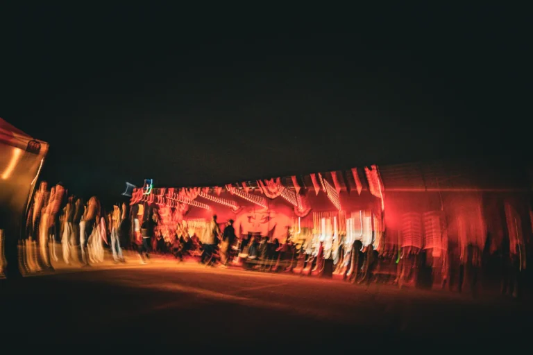 Long-exposure light trails of the Fright Kingdom midway at night
