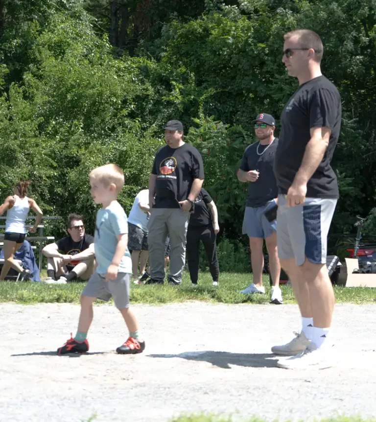 Young boy running the bases at the Nashoba Springs kickball outing