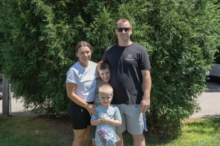 Family posing together at the Nashoba Springs kickball outing