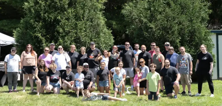 Group photo on the grass at the Nashoba Springs kickball outing
